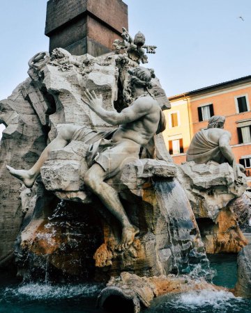Photo for The details of ancient fountain of"Four Rivers", showing the river god Ganges, Piazza Navona, Rome, Italy - Royalty Free Image