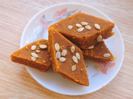 Photo for An Indian sweet called Besan barfi in local language. It is made with gram flour, condensed milk and sugar. - Royalty Free Image