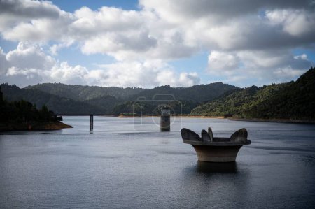 Photo for Nearly full dam and spill way, Mangatangi Reservoir, New Zealand - Royalty Free Image