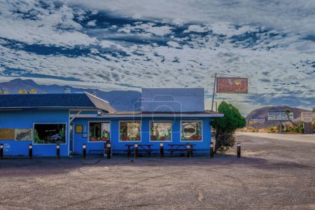 Photo for A scene of the Ghost Town with an old blue cafe during the daytime in Death Valley, Beatty, Nevada, USA - Royalty Free Image