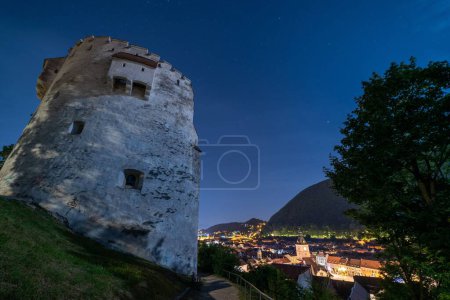 Photo for A beautiful shot of the White Tower Monument and Brasov skyline at night in Transylvania, Romania - Royalty Free Image