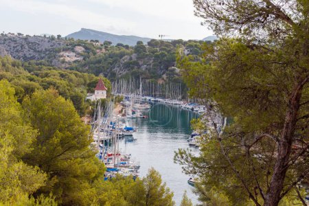Photo for Port-Miou in Cassis France with ships and boats harbouring in blue ocean water. - Royalty Free Image