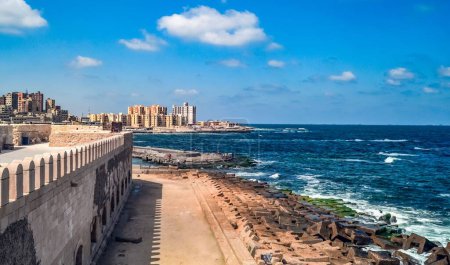 Photo for A beautiful sandy beach and an old wall in Alexandria - Royalty Free Image