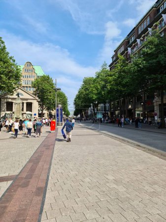 Photo for The shopping street in Hamburg with many customers on a sunny day - Royalty Free Image