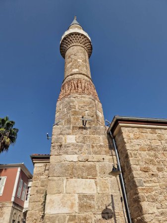 Photo for A vertical low-angle view of Yivliminare Mosque against the blue sky - Royalty Free Image