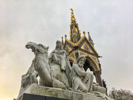 Photo for A low angle view of an "Africa" group sculpture under the Albert Memorial - Royalty Free Image