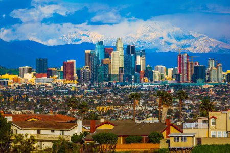 Photo for A beautiful view of the Los Angeles city skyline with a view of snow mountains in the background - Royalty Free Image
