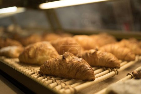 Photo for Delicious fresh croissants just taken out the oven - Royalty Free Image