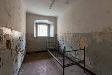 An interior of a delipidated prison cell in the former German Democratic Republic