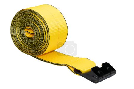 Photo for A scroll of a yellow cargo strap with stainless steel buckle for the roof rack on a white background - Royalty Free Image