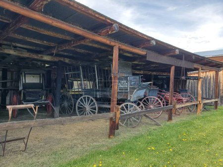 Photo for An old wild western-style yard with antique wagons on wheels - Royalty Free Image