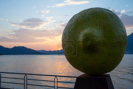 Photo for A sculpture of lemon by Giuseppe Carta near Lake Iseo at sunset - Royalty Free Image