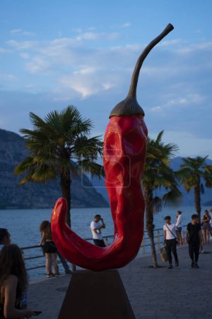 Photo for A sculpture a chili pepper by Giuseppe Carta on Lake Iseo at sunset - Royalty Free Image