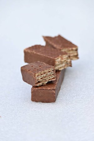 Photo for A vertical shot of chocolate wafers isolated on the white background. - Royalty Free Image