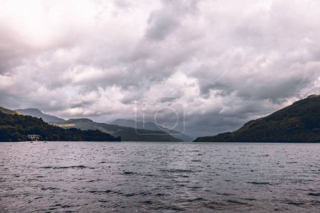 Photo for A beautiful cloudy sky over Loch Lomond Lake in the mountains in Scotland - Royalty Free Image