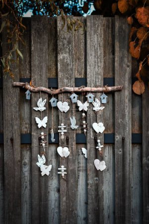 Photo for A peace sign hanging on a wooden fence - Royalty Free Image