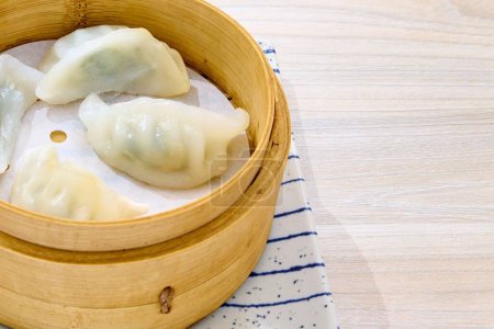 Photo for A closeup of Asian dumplings in a wooden bowl. - Royalty Free Image