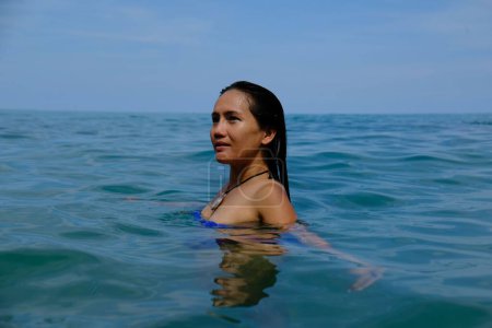 Photo for A close-up shot of a Southeast Asian woman in the sea - Royalty Free Image