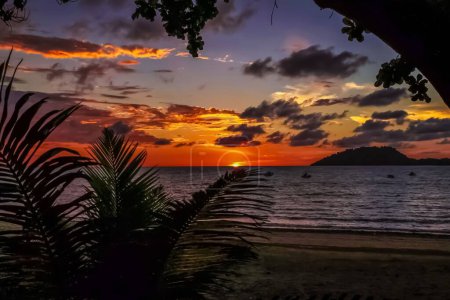 Photo for Beautiful sunset on the coast of Nosy Be Madagascar overlooking Nosy Sakatia island - Royalty Free Image