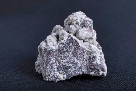 Photo for A closeup view of a sample of Celadonite mineral rock on a black background - Royalty Free Image
