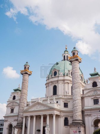 Photo for A vertical low angle shot of the historic Karlskirche church under a bright sky in Vienna, Austria - Royalty Free Image