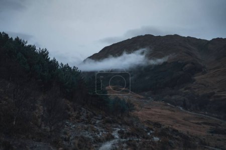Photo for A beautiful view of clouds over the mountains in Glenfinnan hamlet in Scotland. - Royalty Free Image