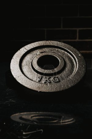 Photo for A vertical shot of a 1 kg metal plate - Royalty Free Image