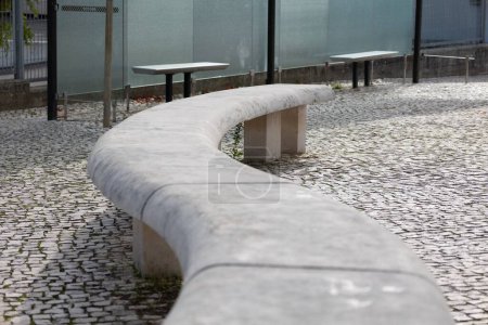 Photo for Park bench in the shape of a snake made of stone - Royalty Free Image