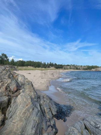 Photo for A vertical shot of the Uto island in the southern archipelago of Stockholm against a blue sky - Royalty Free Image