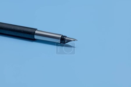 Photo for A closeup shot of a vector pen with a black plastic body and metal accents - Royalty Free Image