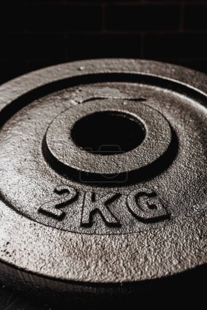 Photo for A vertical shot of a 2 kg metal plate - Royalty Free Image