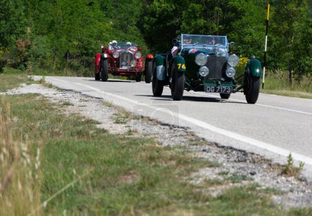 Photo for URBINO - ITALY - JUN 16 - 2022 : ASTON MARTIN LE MANS 1933 on an old racing car in rally Mille Miglia 2022 - Royalty Free Image