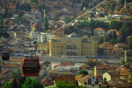 A cityscape view of Sarajevo City Hall with traditional buildings and trees in Bosnia and Herzegovina