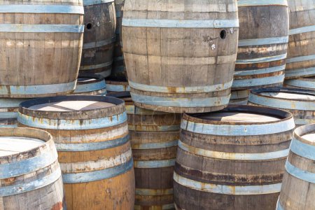 Photo for A closeup of wooden barrels for alcohol - Royalty Free Image