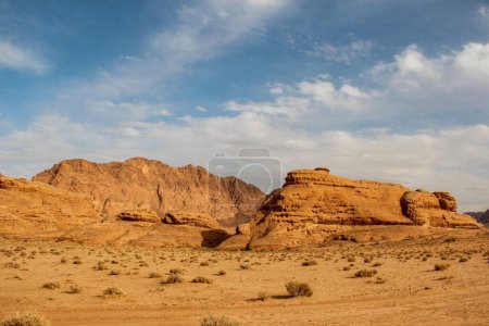 Photo for A beautiful scene of a Wadi Rum Reserve with orange sand and cliffs in Wadi Rum Village, Jordan - Royalty Free Image