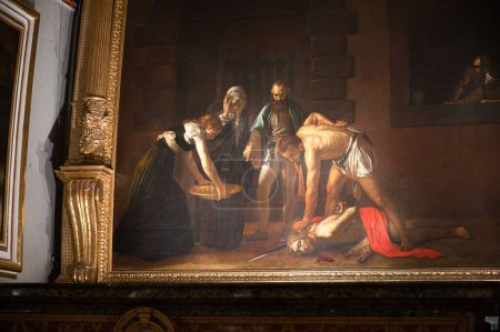 Foto de La pintura que representa La decapitación de San Juan Bautista de Caravaggio en el Oratorio de la Co-Catedral de San Juan - Imagen libre de derechos