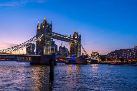 Photo for A scenic shot of the Tower Bridge and the city skyline in London, Europe during dusk - Royalty Free Image