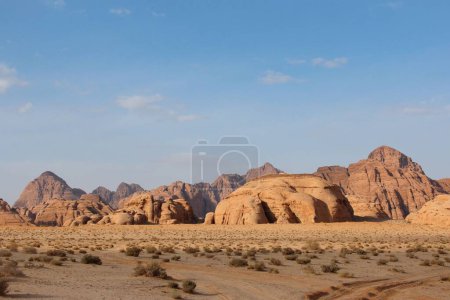 Photo for A beautiful scene of a Wadi Rum Reserve with orange sand and cliffs in Wadi Rum Village, Jordan - Royalty Free Image