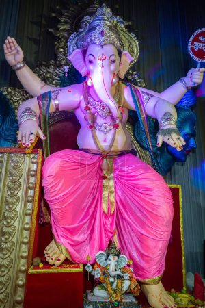 Photo for A vertical shot of the statue of Lord Ganesh at mandal in Mumbai for the festival of Ganesh Chaturthi - Royalty Free Image