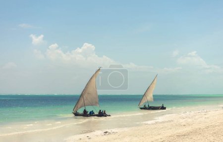 Photo for A landscape view of a boat on the beach on sunny day - Royalty Free Image