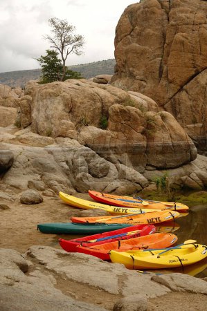 Photo for A verticals shot of the colorful kayaks on the shore at the Watson lake - Royalty Free Image