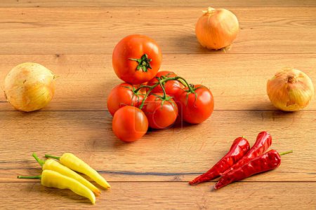 Photo for A beautiful closeup of various vegetables of some onions, tomatoes and some chillies - Royalty Free Image