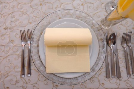 Photo for A top view of a plate with silverware on the table - Royalty Free Image