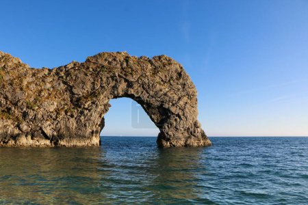 Photo for A scenic shot of the Durdle door in Cornwall under the blue summer sky - Royalty Free Image
