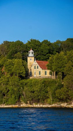 Photo for The Eagle Bluff Lighthouse on a sunny day in Peninsula State Park in Door County, Wisconsin - Royalty Free Image