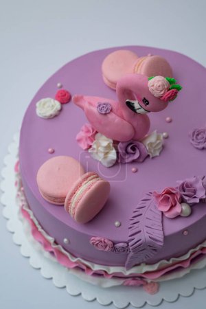 Photo for A beautiful view of birthday cake decorated with macarons and flamingo bird - Royalty Free Image