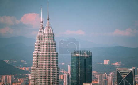 Photo for An aerial of the Petronas Towers on a gloomy day, Kuala Lumpur, Malaysia - Royalty Free Image