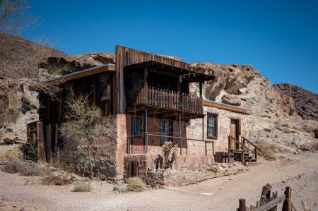 Photo for Old house from the old mining town of Calico, stone house with wooden balcony. - Royalty Free Image