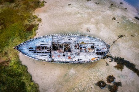 Photo for The aerial top view of an old ship at the beach on a sunny day in Donegal - Royalty Free Image