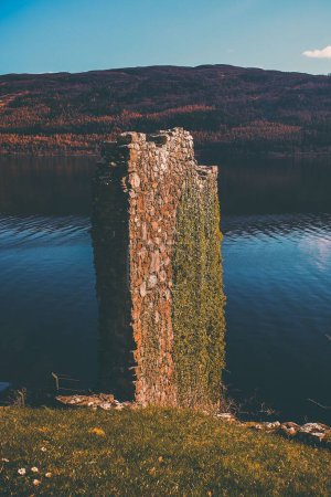 Photo for A vertical shot of a wall of an old Scottish castle on the Ness loch. - Royalty Free Image